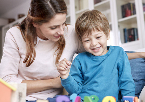 mother-and-son-playing-with-toys_485x342