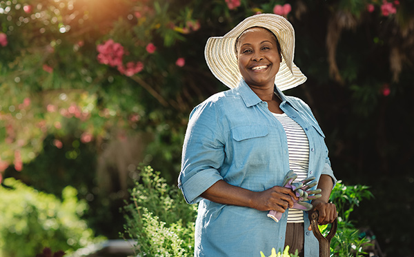 portrait-of-smiling-woman-gardening-maintaining-healthy-skin_450x280