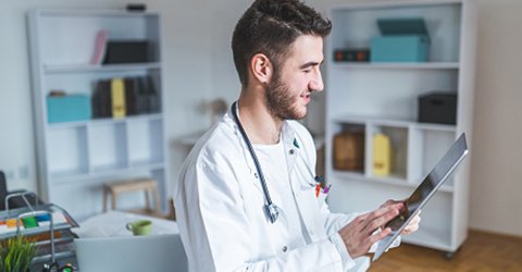 clinician-tapping-on-digital-tablet-continued-ostomy-education-learning_480x250