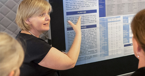 clinicians-reviewing-poster-presentation-continence-care-clinical-research-and support_480x250