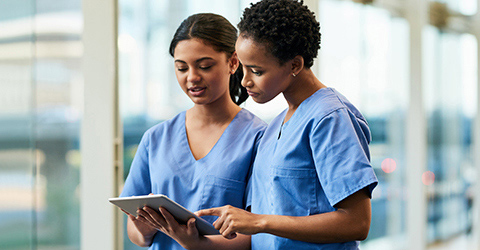 two-clinicians-using-a-digital-tablet-ostomy-clinical-research-and-support_480x250