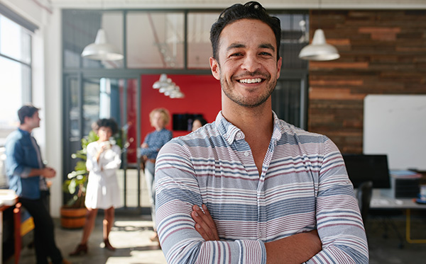 smiling-man-in-modern-office-hollister-ostomy-care-learning-center