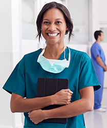 smiling-nurse-holding-tablet-hollister-clinical-education